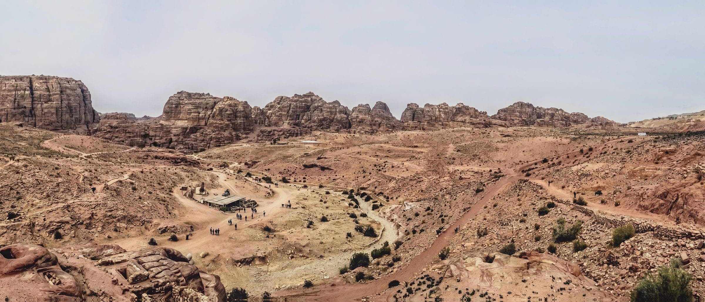 Sandstone cliffs and open desert in Wadi Rum, Jordan