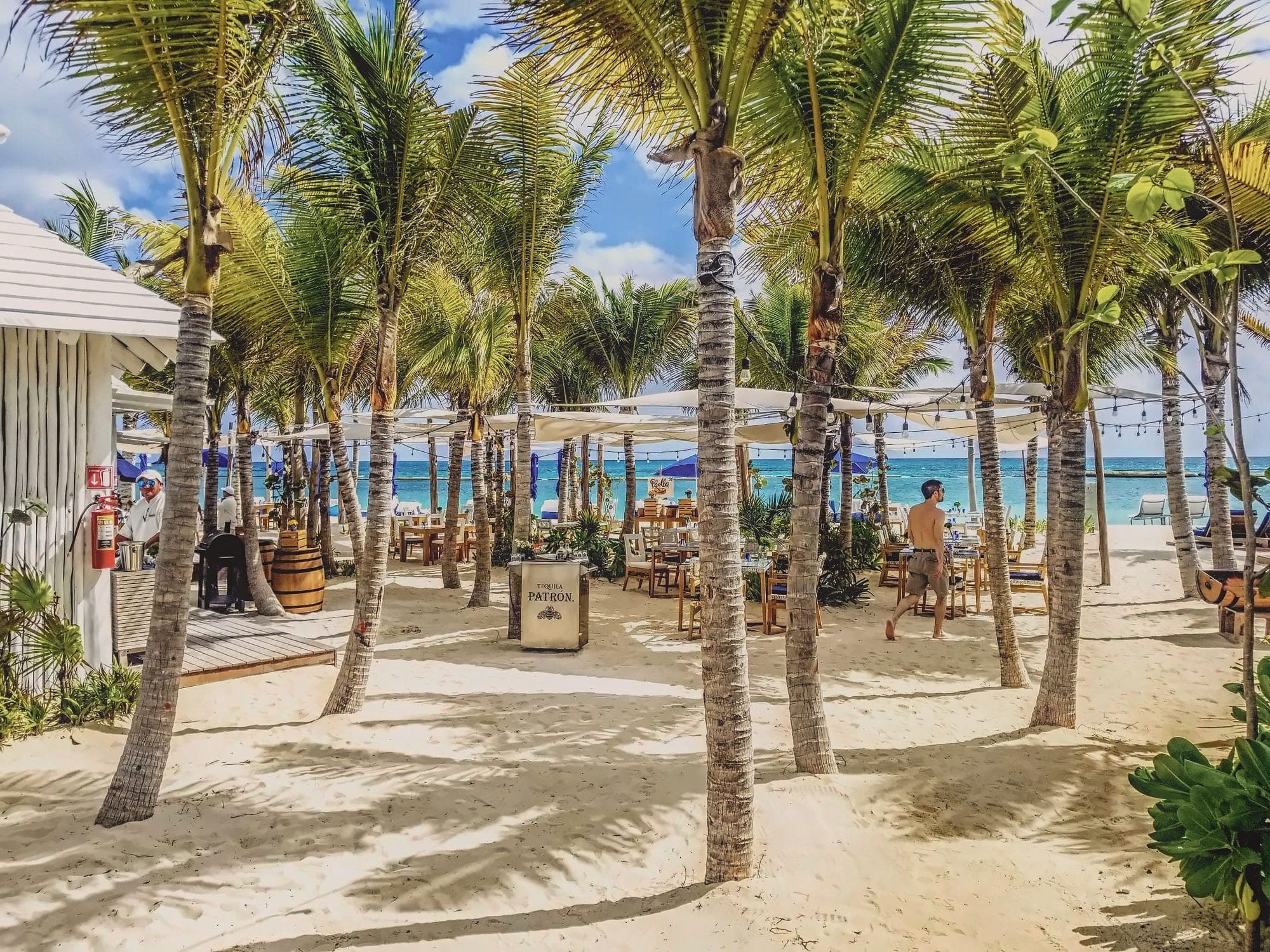 A palm-shaded white-sand beach at Mayakoba, Riviera Maya